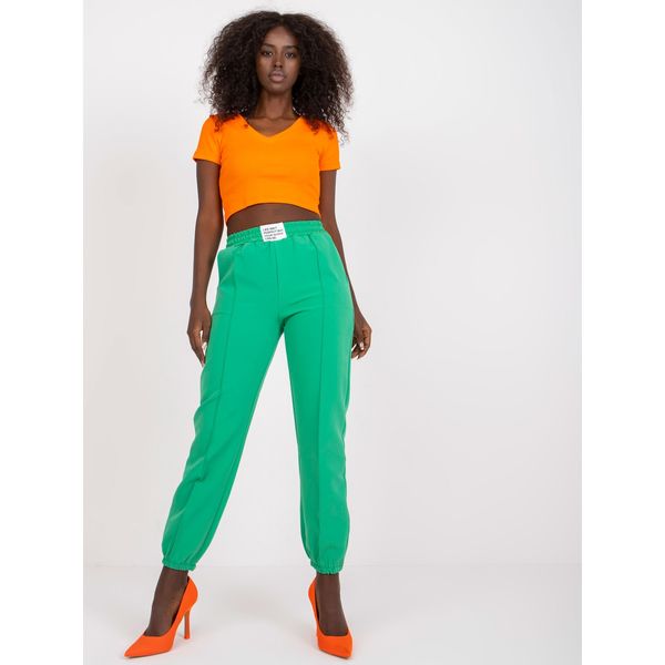 Fashionhunters Dark green women's trousers in a fabric with a crease
